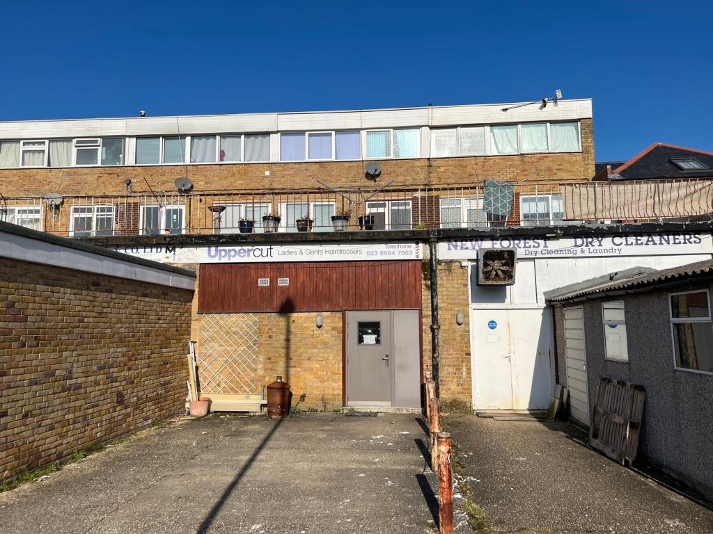 Lot: 136 - VACANT GROUND FLOOR COMMERCIAL AND TWO STOREY MAISONETTE - Rear View of Commercial and Two Story Maisonette Seen from New Road Car Park